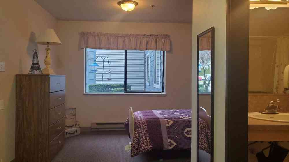 One-bedroom apartment window and bedroom area