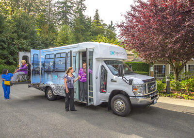 Residents beside the Rosewood Courte coach